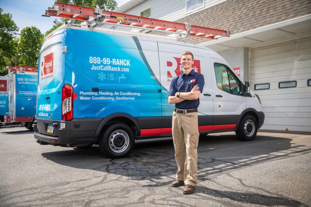 worker in front of van