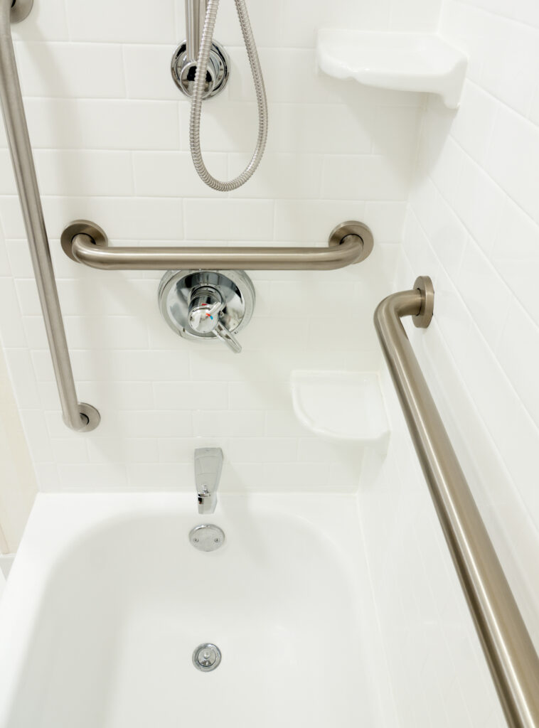 Bathroom safety grab bars inside a tub-shower.