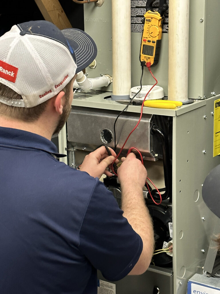 HVAC technician performing a routine maintenance